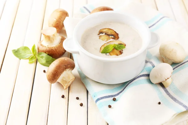 Mushroom soup in white pot, on napkin — Stock Photo, Image