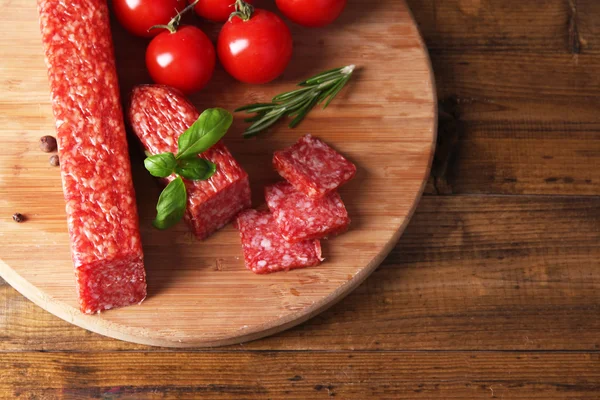 Tasty salami sausage and spices — Stock Photo, Image