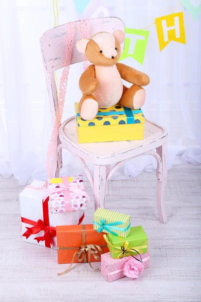 Many birthday gifts in room — Stock Photo, Image