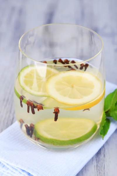 Fresh summer drink with lime and cloves — Stock Photo, Image
