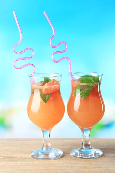 Grapefruit cocktail with cocktail straw