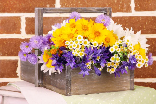 Beautiful flowers in crate — Stock Photo, Image