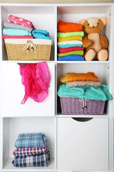 Clothes on shelves — Stock Photo, Image