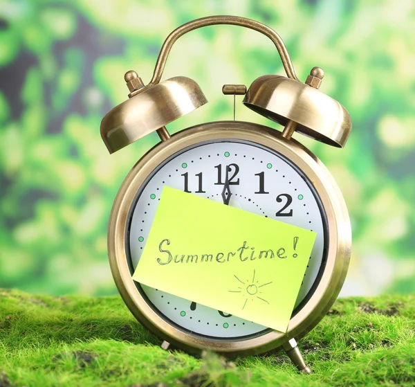 Old clock on grass — Stock Photo, Image