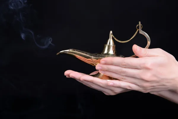 Magic lamp in hands — Stock Photo, Image