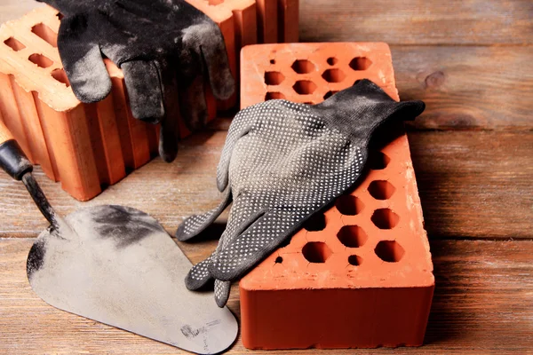 Gloves and bricks — Stock Photo, Image