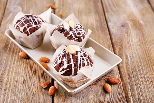 Tasty cupcakes with nuts on table close-up — Stock Photo, Image