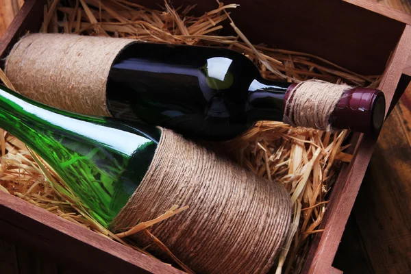 Bottles of wine in wooden box — Stock Photo, Image