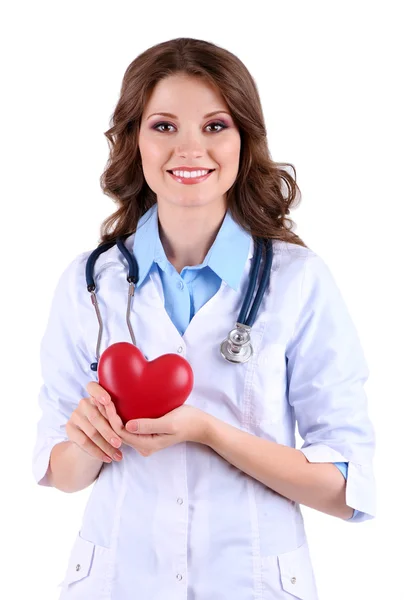 Jonge mooie arts met een stethoscoop houden hart geïsoleerd op wit — Stockfoto