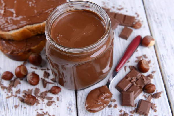 Sweet chocolate cream in jar — Stock Photo, Image