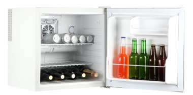 Mini fridge full of bottles of alcoholic beverages isolated on white clipart