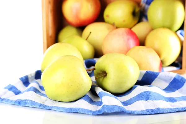 Juicy apples on napkin in box — Stock Photo, Image