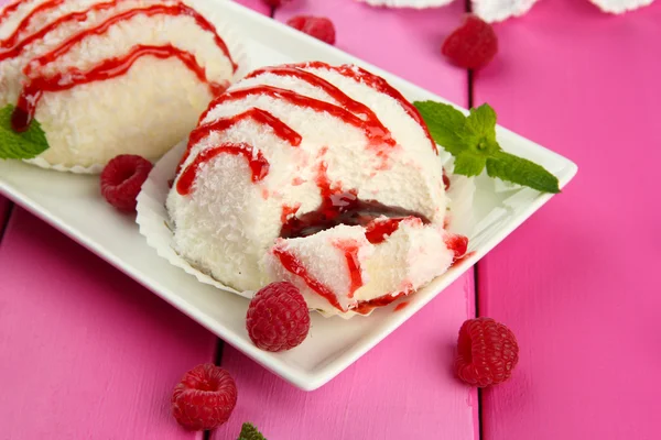 Delicious coconut cakes on plate on table close-up — Stock Photo, Image