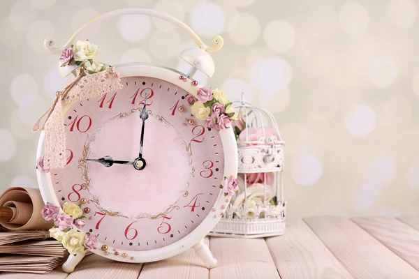 Vintage alarm clock with flowers — Stock Photo, Image