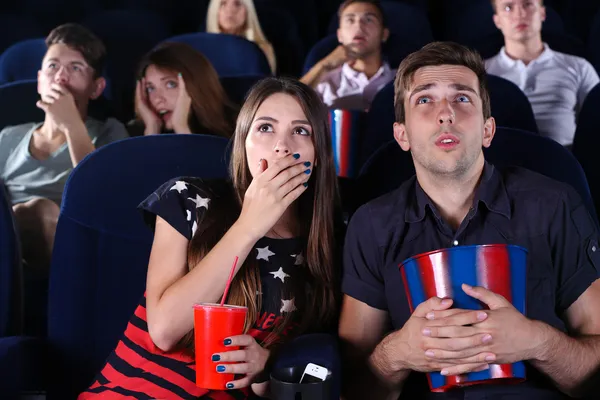 Young people watching movie in cinema — Stock Photo, Image