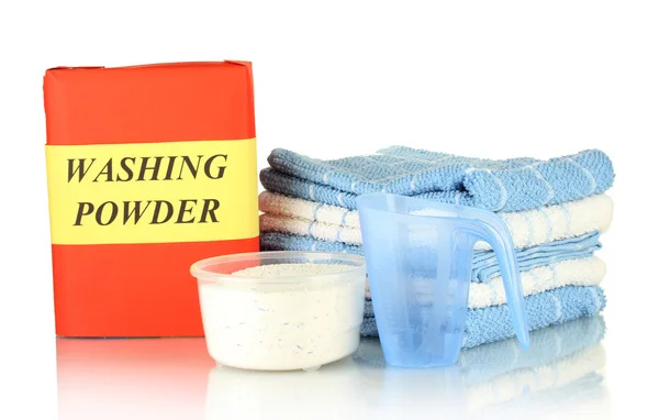 Box of washing powder with measuring cup and towels — Stock Photo, Image