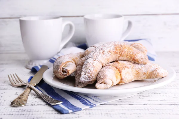 Tasty bagels with powdered sugar — Stock Photo, Image