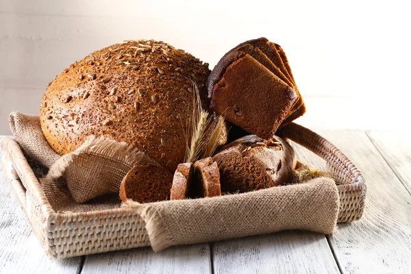 Fresh bread on wooden table — Stock Photo, Image