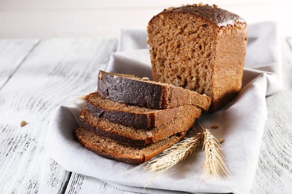 Fresh bread on wooden table — Stock Photo, Image