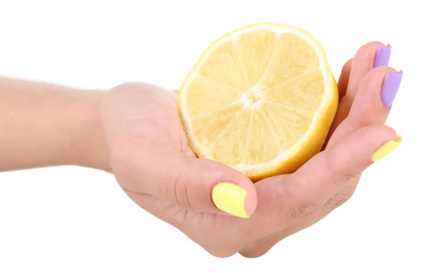 Female hand with colorful nails holding lemon — Stock Photo, Image