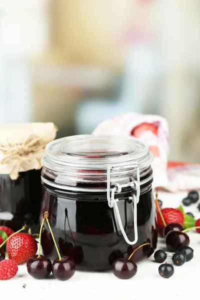 Jam with berries in glass jar — Stock Photo, Image