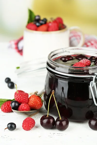 Jam with berries in glass jar — Stock Photo, Image