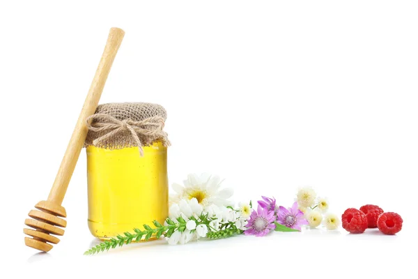 Jar full of honey and wild flowers — Stock Photo, Image