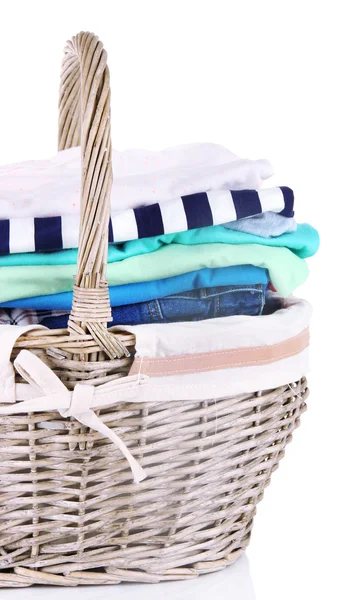 Bright clothes in laundry basket, isolated on white — Stock Photo, Image