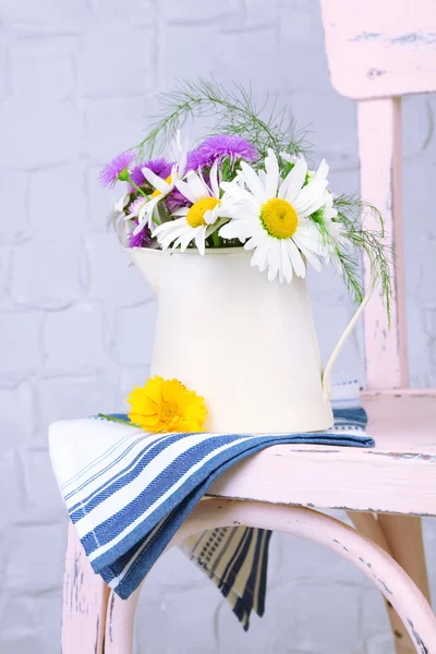 Bouquet of flowers in decorative jug — Stock Photo, Image