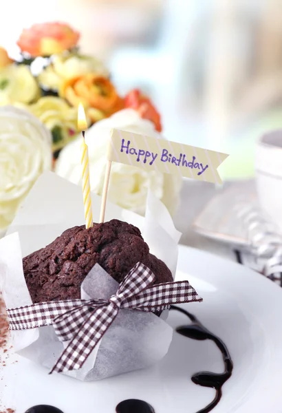 Chocolate muffin with chocolate sauce — Stock Photo, Image
