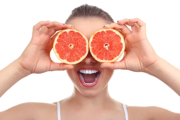 Menina bonita com toranja, isolado em branco — Fotografia de Stock