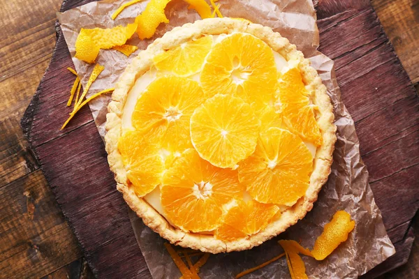 Homemade orange tart on wooden background — Stock Photo, Image