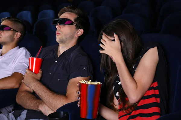 Young people watching movie in cinema — Stock Photo, Image