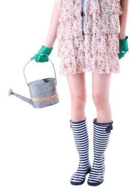 sulama olabilir, üzerinde beyaz izole tutan genç kadın kauçuk botlar