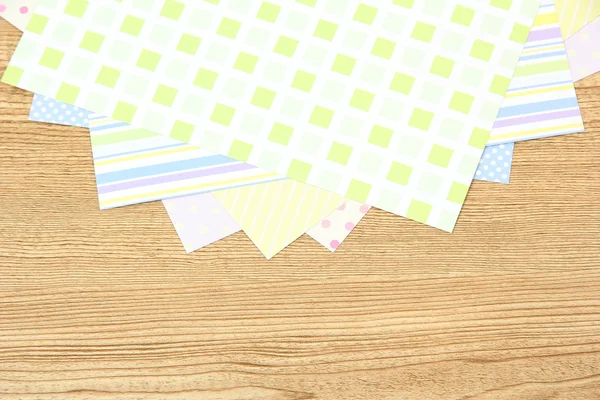 Paper for scrapbooking, on wooden table — Stock Photo, Image