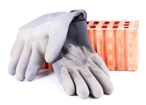Vuile gebruikte rubberen handschoenen en bakstenen, geïsoleerd op wit — Stockfoto