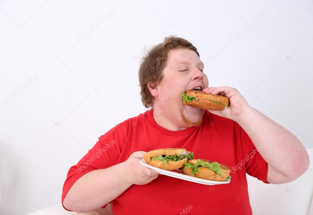 Fat man eating tasty sandwich  isolated on white