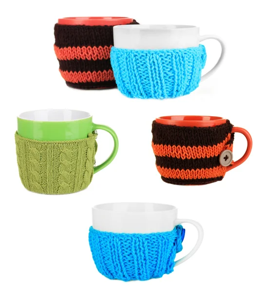 Cups with knitted thing on it isolated on white — Stock Photo, Image
