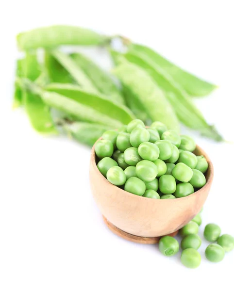 Fresh green peas in wooden bowl, isolated on white background — Stock Photo, Image