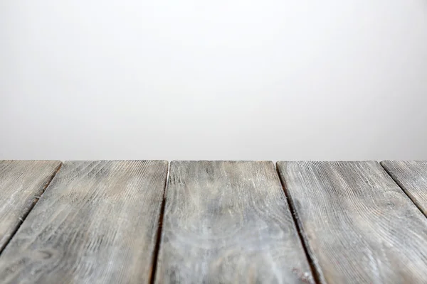 Rustic wooden board on grey background — Stock Photo, Image