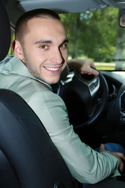 Man sitting in car — Stock Photo, Image