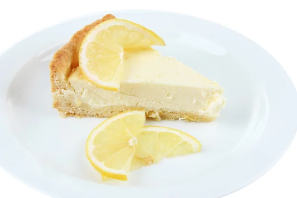 Slice of  lemon cheesecake on plate, isolated on white — Stock Photo, Image