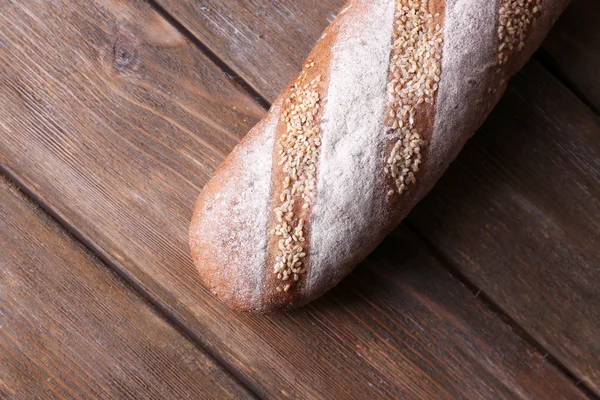 Chleb na drewniane tła — Zdjęcie stockowe