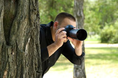 Man photographs in street clipart