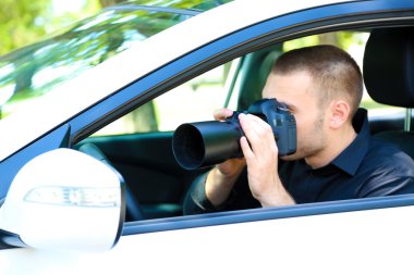 Man in car with photo camera clipart