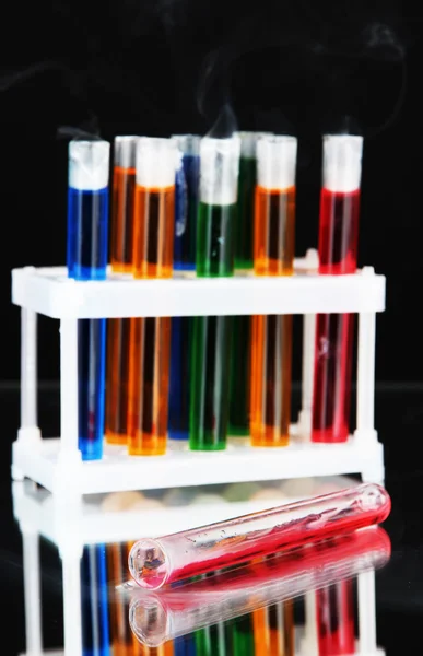 Laboratory test tubes on black background — Stock Photo, Image