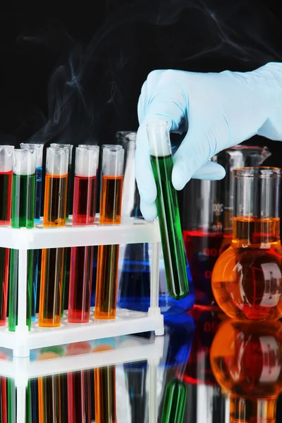 Laboratory test tubes on black background — Stock Photo, Image