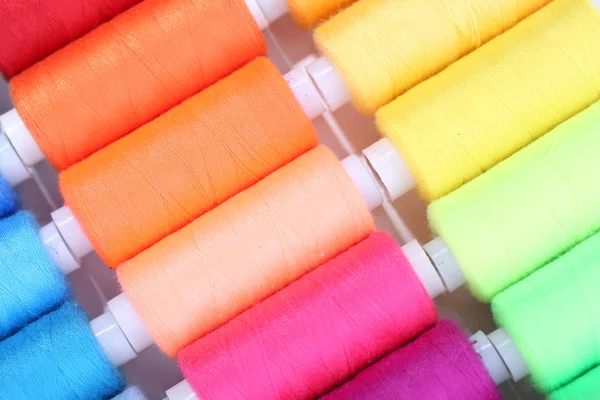 Multicolor sewing threads background — Stock Photo, Image