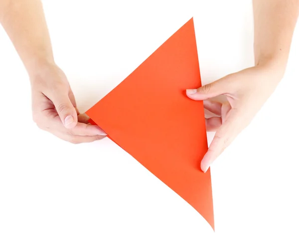 Manos haciendo origami pájaro, de cerca, aislado en blanco — Foto de Stock