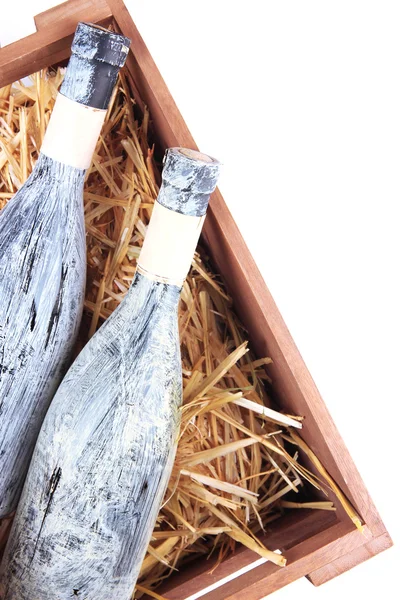 Flessen wijn in houten kist — Stockfoto